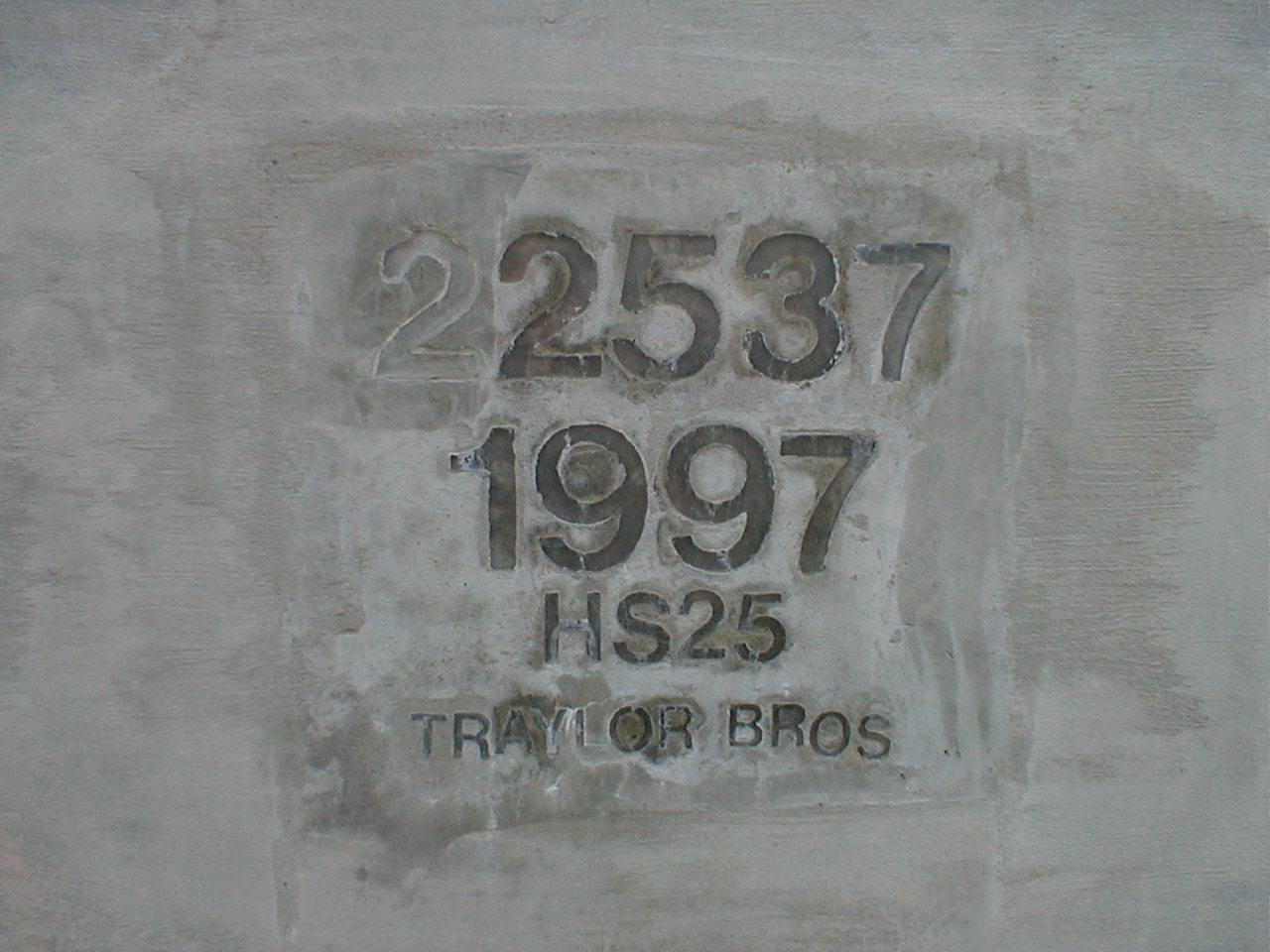 An inscription in eastern barricade at the Kentucky end of the bridge.