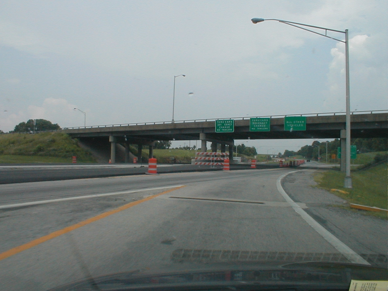 Toll instruction signage above Exit 62 is readable.