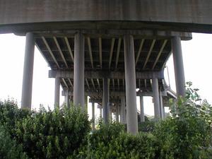Ramps splitting from and joining to I-65 underneath the Kennedy Bridge at the I-64-I-65-I-71 Spaghetti Junction interchange.