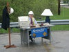 [Transportation Cabinet official Tim Henderlight set up a desk in a highway work zone in Breathitt County Friday to make his point as he discussed the need for driving safely in construction zones.]