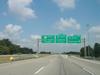 Northbound on Gene Snyder Freeway at Exit 35 for I-71. I-265 ends here; KY 841 continues north. (July 6, 2003)